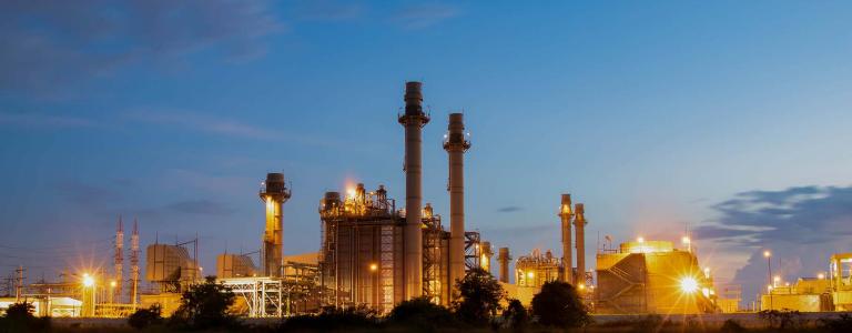 Natural gas, power plant against a dark sky.