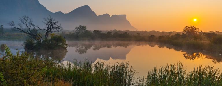 Sun setting over lake in South Africa