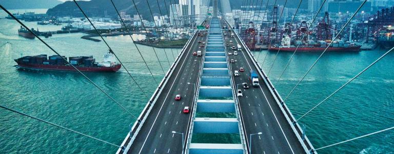 Bridge in Hong Kong and Container Cargo freight ship