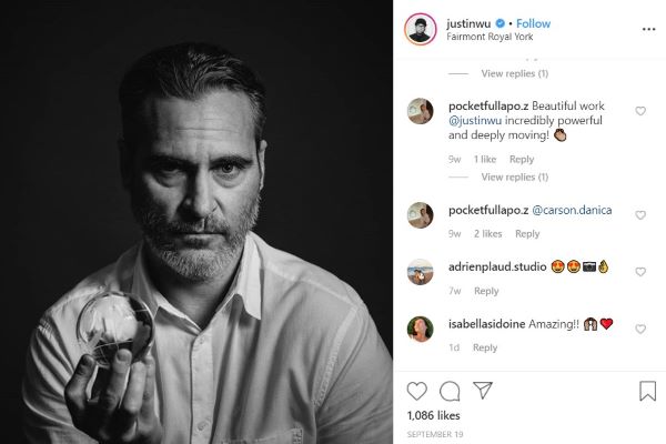 Actor Joaquin Phoenix holding a crystal globe